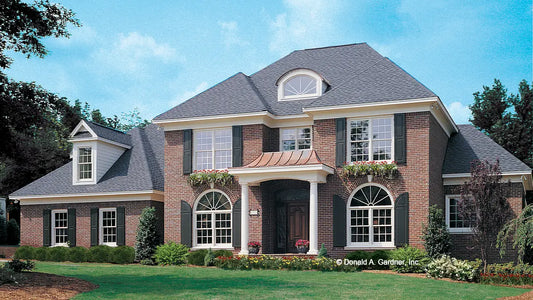 This is a photograph of the front of classical house plan 868 The Santerini as built by a customer