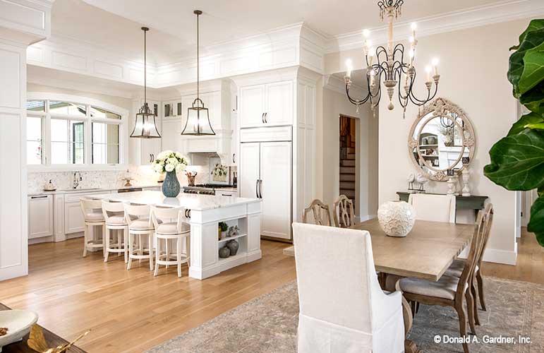 An open dining room gives space for both formal and casual dining for Luxury house plan 1403 The Sarafine