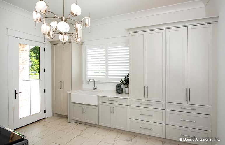 Plenty of storage and counter space in the utility room in Walkout Basement house plan 1403 The Sarafine