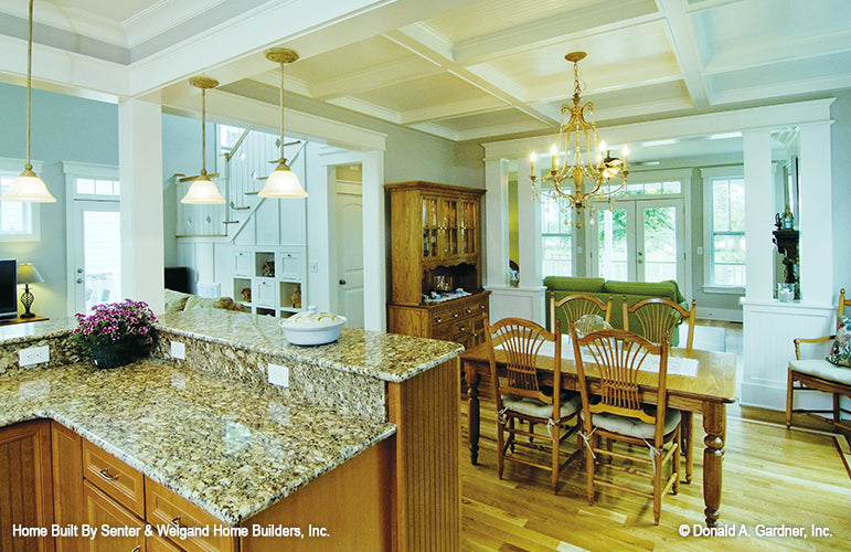 Kitchen view to the dining room, open concept. The Sassafras plan 814.