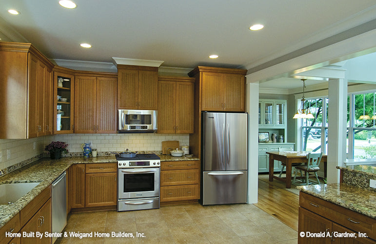 Flat ceiling and recessed lights in the kitchen. The Sassafras plan 814.