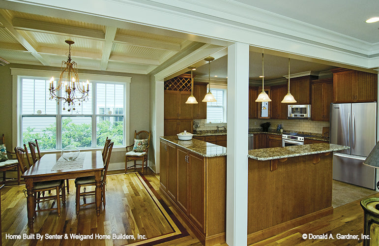 Full view of the dining room and kitchen side by side. The Sassafras plan 814.