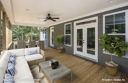 Screened in porch with flat ceiling and outdoor ceiling fan. The Satchwell plan 967