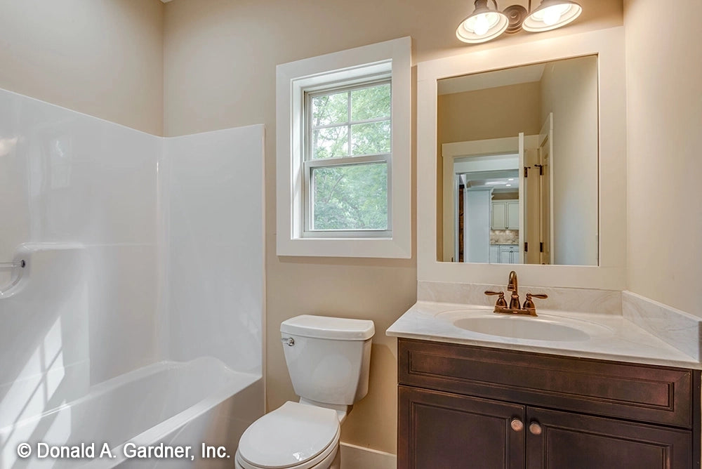 A secondary bathroom for small house plan 1422 The Sawyer