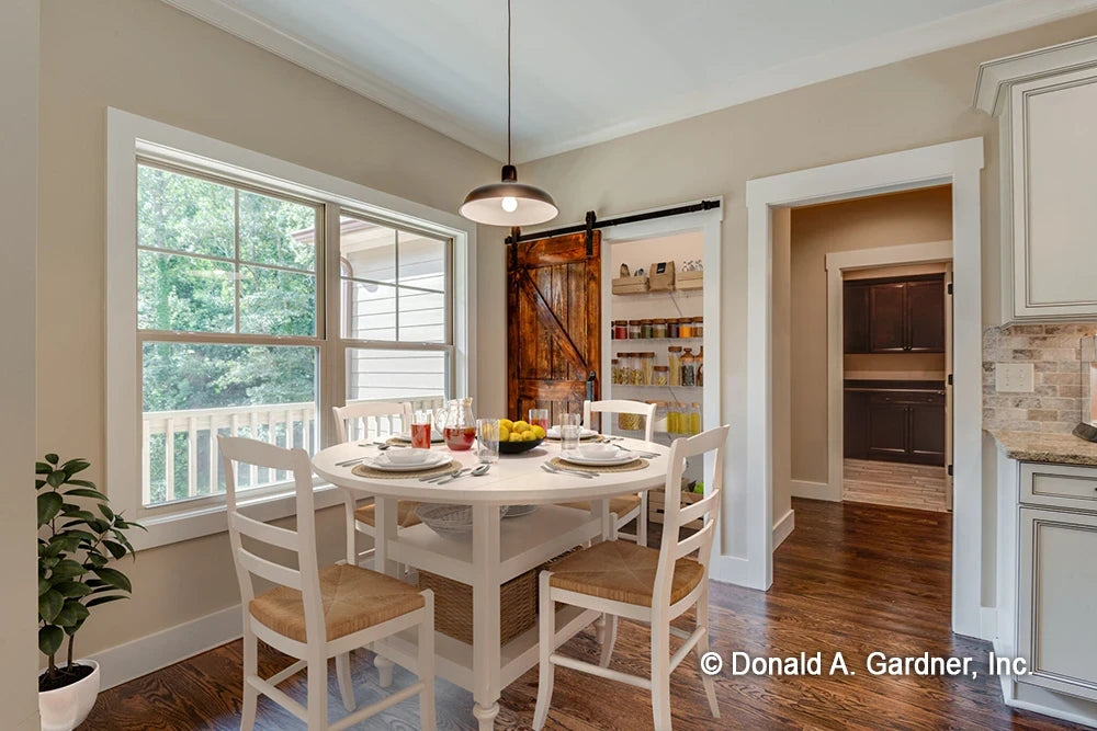 A cozy breakfast nook for casual dining in small house plan 1422 The Sawyer