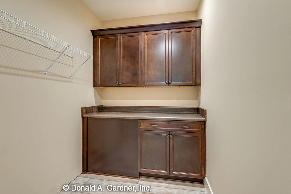 Plenty of storage and counter space in the utility room in modern farmhouse house plan 1422 The Sawyer