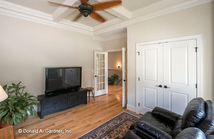 Along with the coffered ceiling the bonus room has crown molding and double doors.