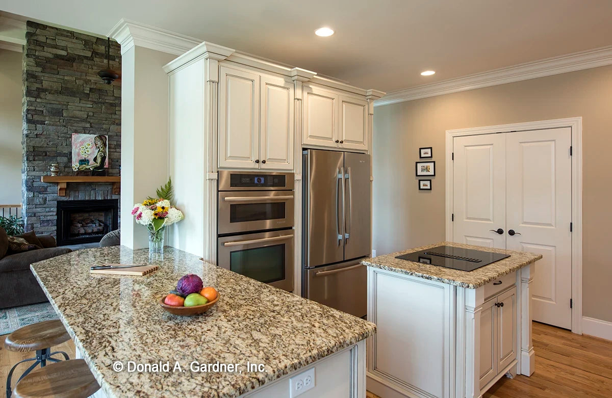 Kitchen with stainless steel appliances and views into the great room