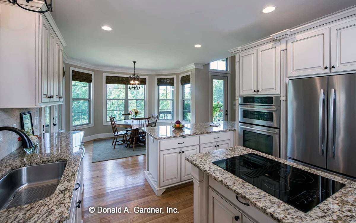 The kitchen features granite counter tops and is connected to the breakfast nook