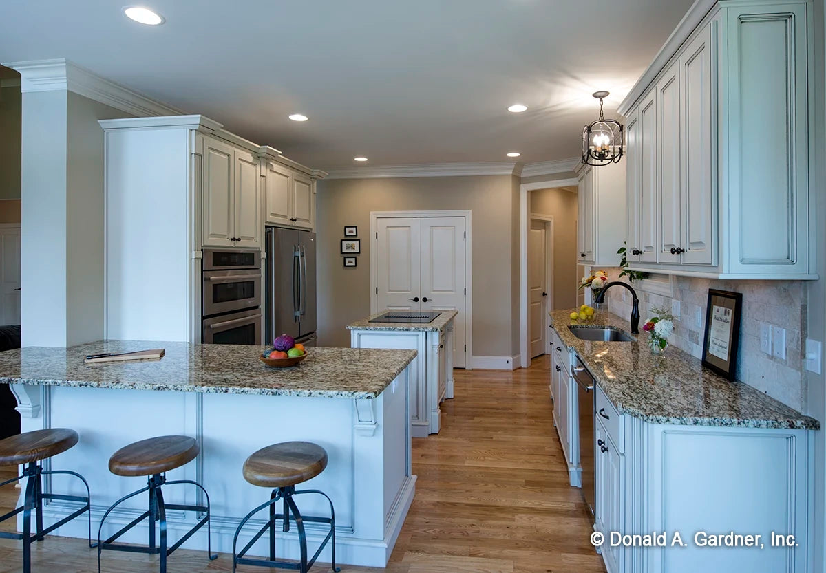 Overlook entire kitchen, display of the bar sitting area. Silvergate Plan 1254