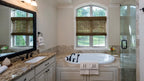 Master bath has a very large soaking tub, granite counters and an arched ceiling