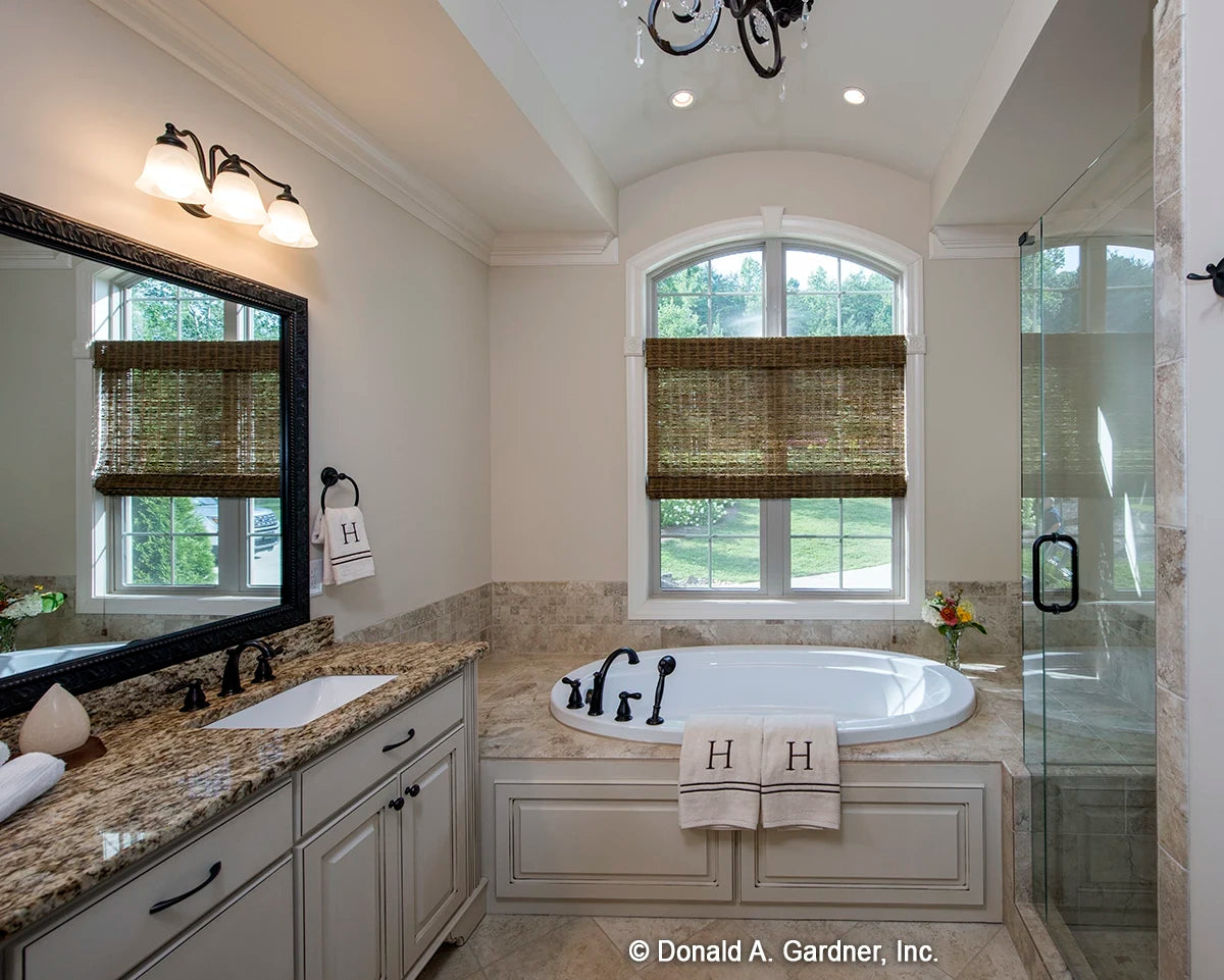 Master bath has a very large soaking tub, granite counters and an arched ceiling