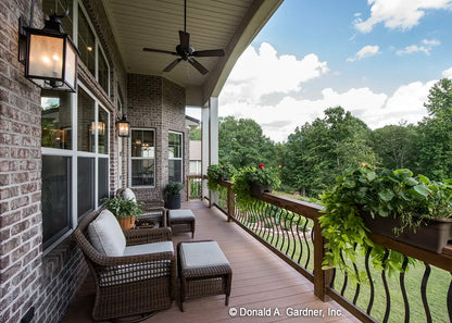 The large relaxing rear deck shows the breakfast nook windows