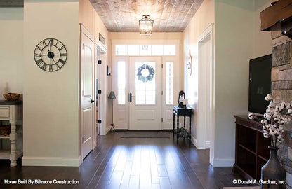 Windows along the entry door in the foyer. The Simon plan 1351.