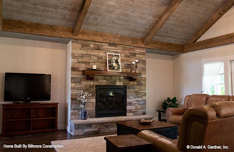 Stone fireplace in the great room. The Simon plan 1351.