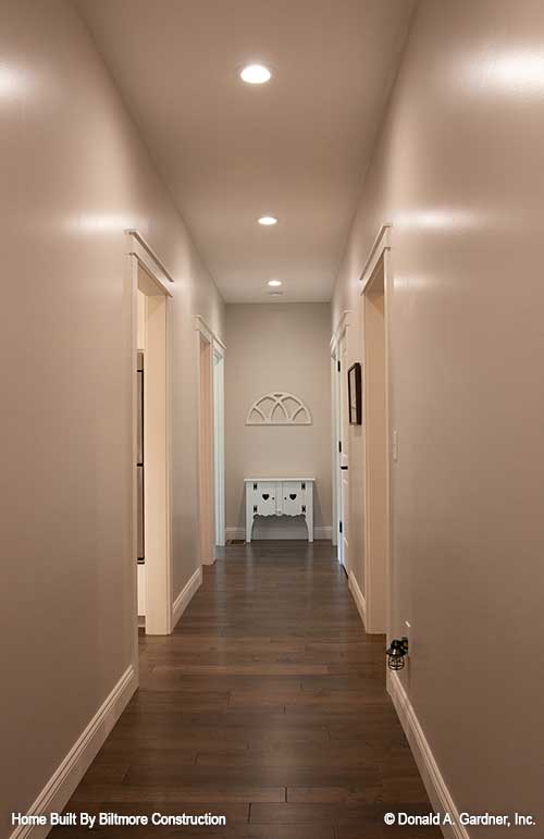 Hallway with recessed lighting. The Simon plan 1351.