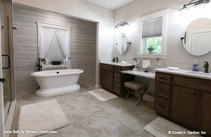 Stand-alone soaking tub in the master bathroom. The Simon plan 1351.