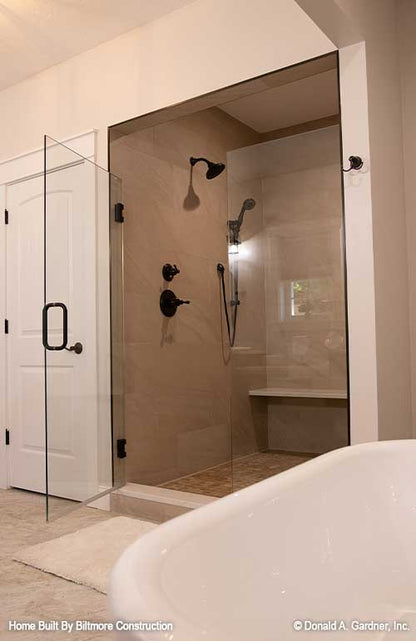 Tiled walk-in shower in the master bathroom. The Simon plan 1351.