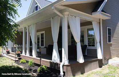 Outdoor curtains on the rear porch. The Simon plan 1351.