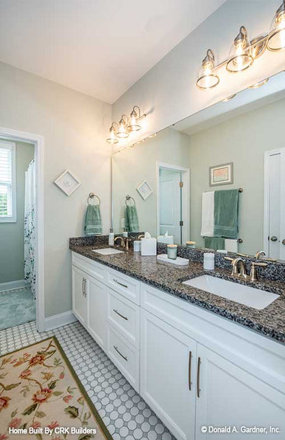 Double sink vanity in bathroom. Sloan plan 1528