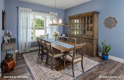 Inviting dining room with flat ceiling. Sloan plan 1528