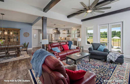 Open floor view of the great room into the kitchen and dining rooms. Sloan plan 1528