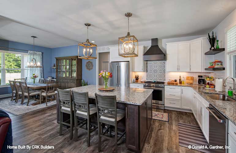 Open view of the kitchen and dining room side by side. Sloan plan 1528