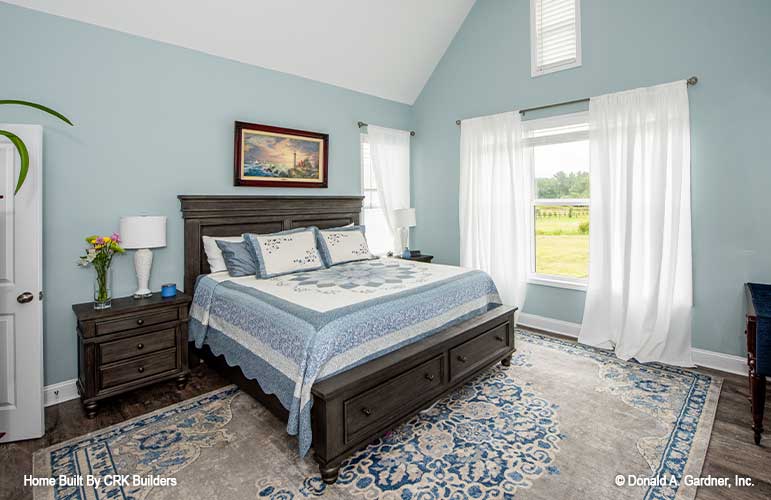 Well-lit spacious master bedroom with vaulted ceiling. Sloan plan 1528