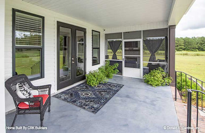 View of the back patio alongside the screened in porch. Sloan plan 1528