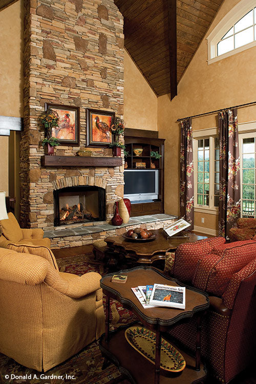 Floor to ceiling stone fireplace in the great room. The Solstice Springs plan 5011.