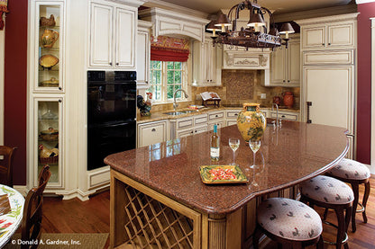 Island seating in the kitchen. The Solstice Springs plan 5011.