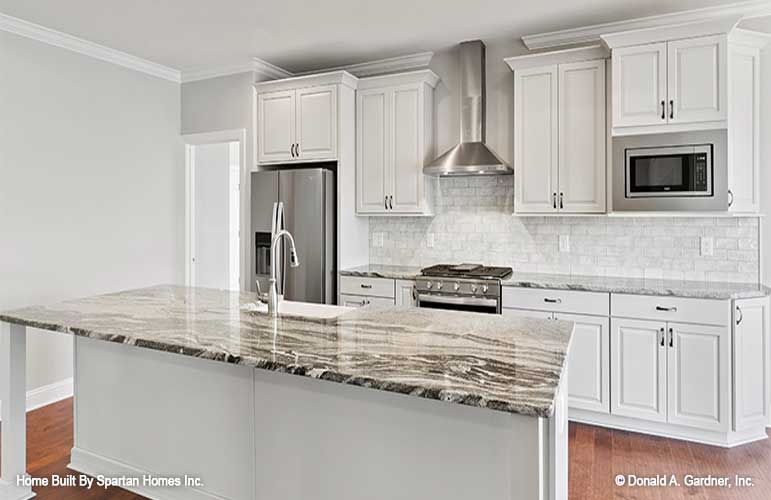 This is a kitchen picture of walkout basement house plan 1143 The Somersby