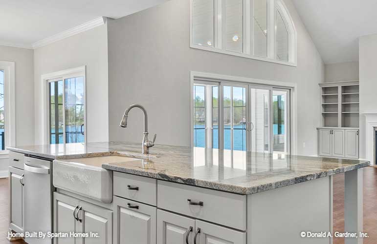 This is a kitchen island picture of walkout basement house plan 1143 The Somersby