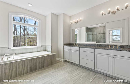 This is a master bathroom picture with vanity of walkout basement house plan 1143 The Somersby