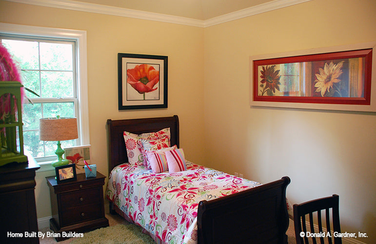 Crown molding along the ceiling and window in the secondary bedroom. The Sorvino plan 1222.