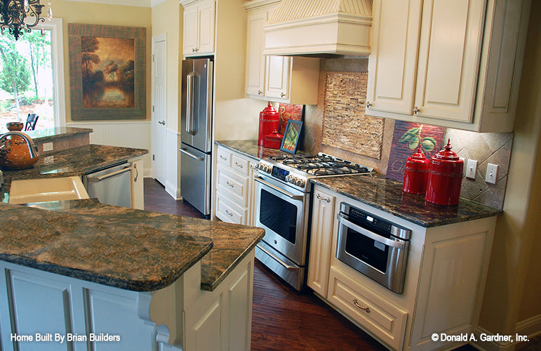 Stainless-steel appliances in the kitchen. The Sorvino plan 1222.