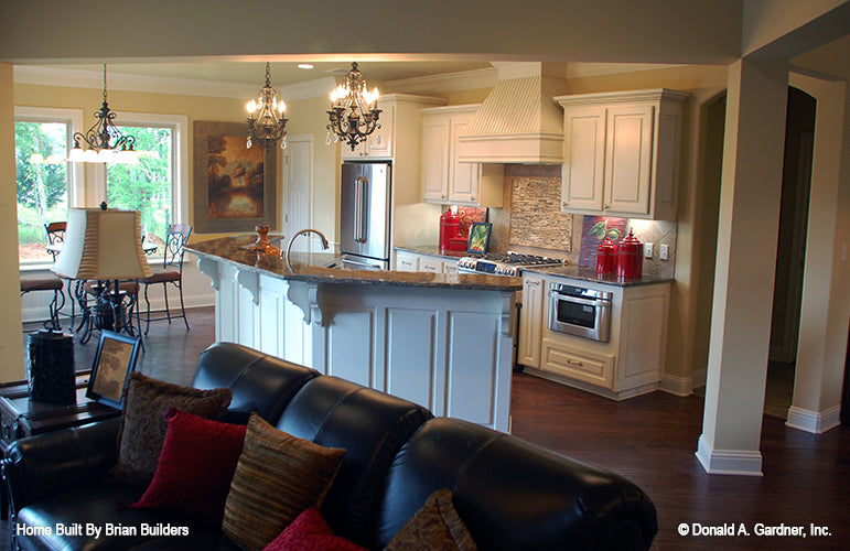 Kitchen island with bar ledge in the kitchen. The Sorvino plan 1222.