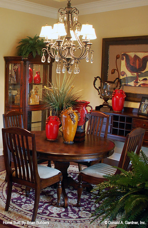 Crown molding along the ceiling and chandelier in the dining room. The Sorvino plan 1222.