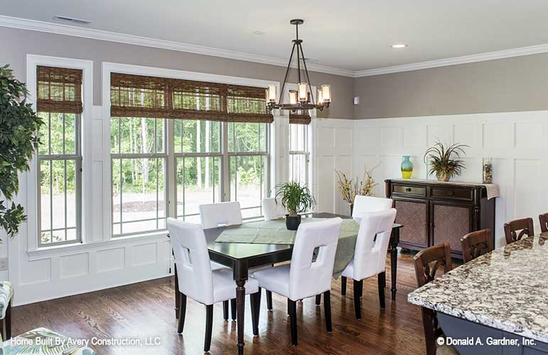 Well-lit dining room picture for house plan 1310 The Spotswood