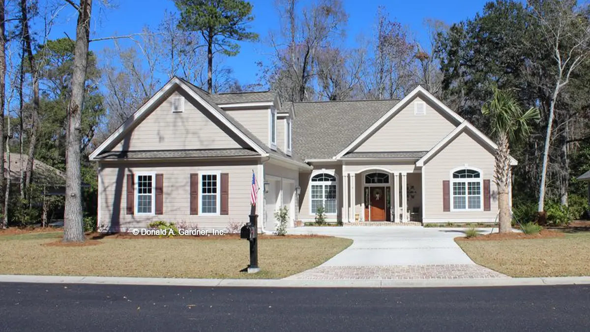 charming courtyard load garage cottage style home