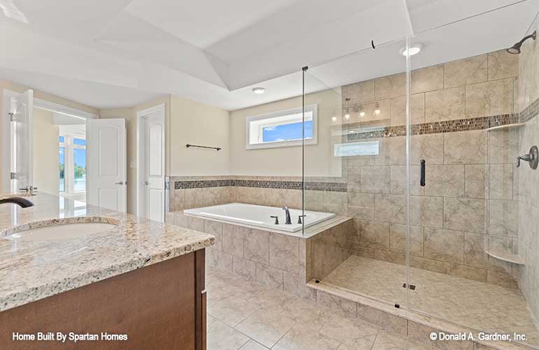 This picture shows the bathroom tub and shower of luxury house plan 876 The Steeplechase