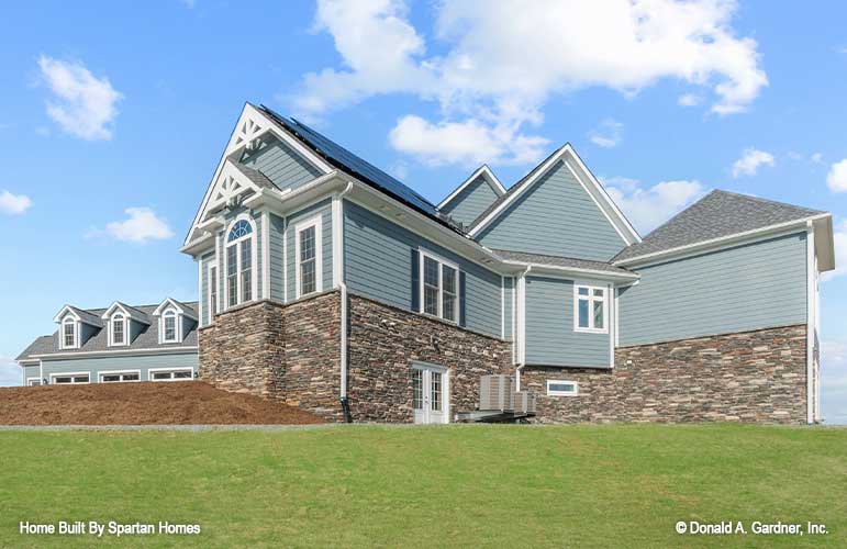 This picture shows the side exterior of luxury house plan 876 The Steeplechase