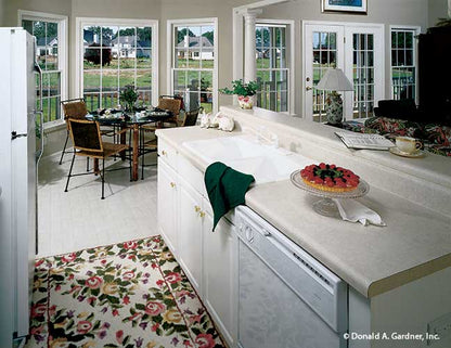 White cabinets and appliances in the kitchen. The Stratford plan 384.