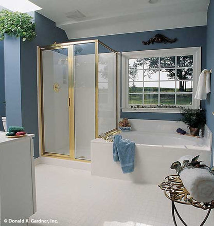 Soaking tub next to the walk-in shower in the master bathroom. The Stratford plan 384.