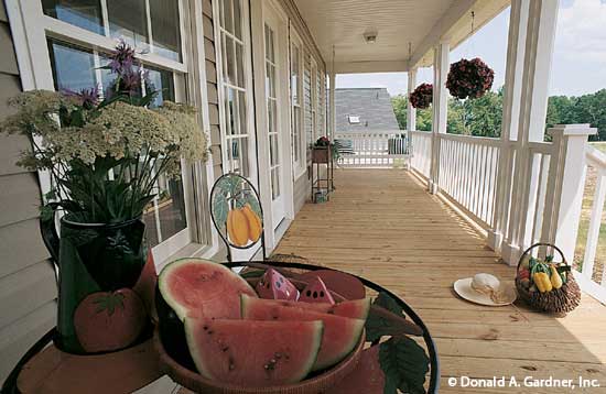 White railing on the rear porch. The Stratford plan 384.