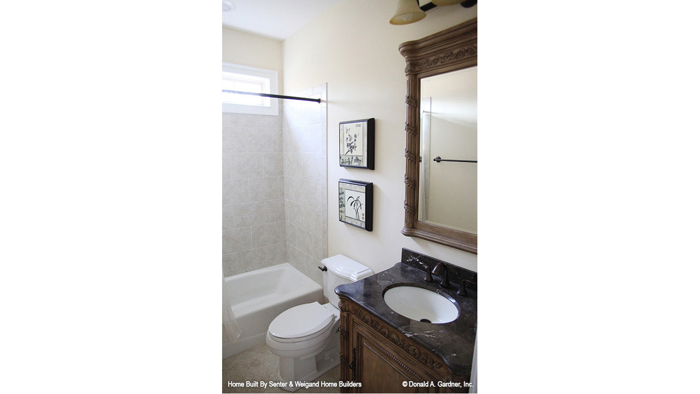 Single sink vanity and tub in the bathroom. The Summerhill plan 1090.