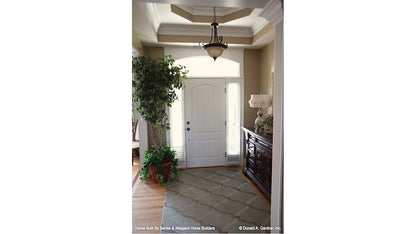 Arched window above the door in the foyer. The Summerhill plan 1090.