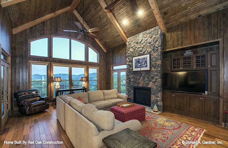 Vaulted ceiling and stone fireplace in the great room. The Sylvan plan 1321. 