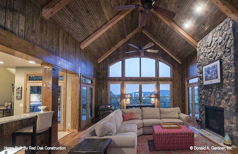 Double ceiling fans and arched windows in the great room. The Sylvan plan 1321.