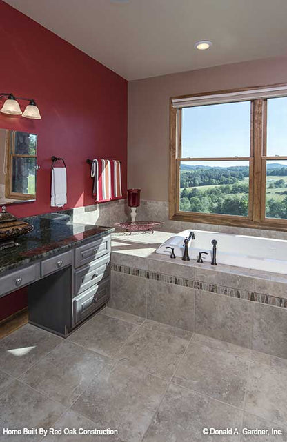 Sitting tub with windows above in the master bathroom. The Sylvan plan 1321.